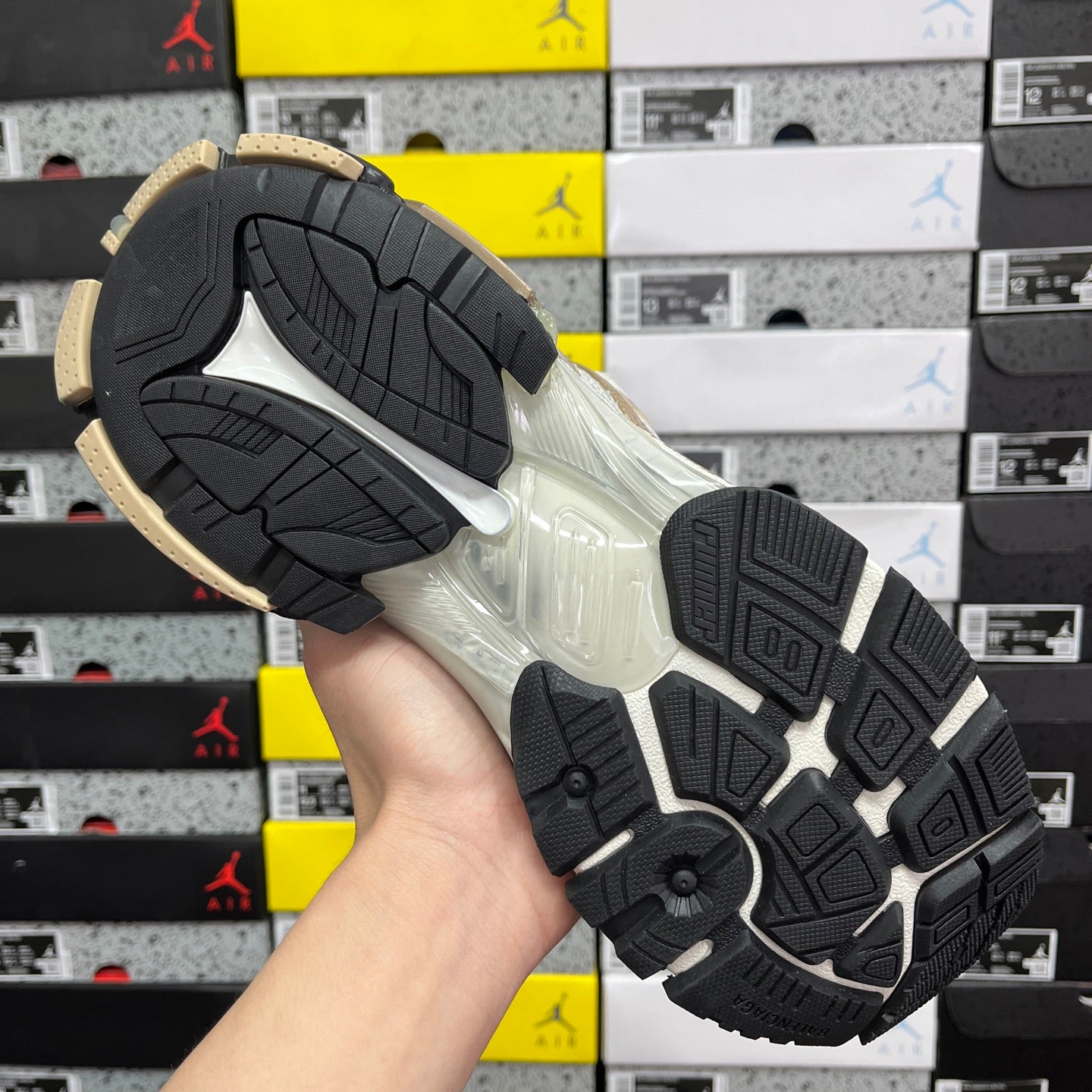 Balenciaga unisex sneaker outsole with black traction tread and light gold edges