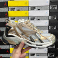 Balenciaga unisex sneakers in light gold and white with black heel accents