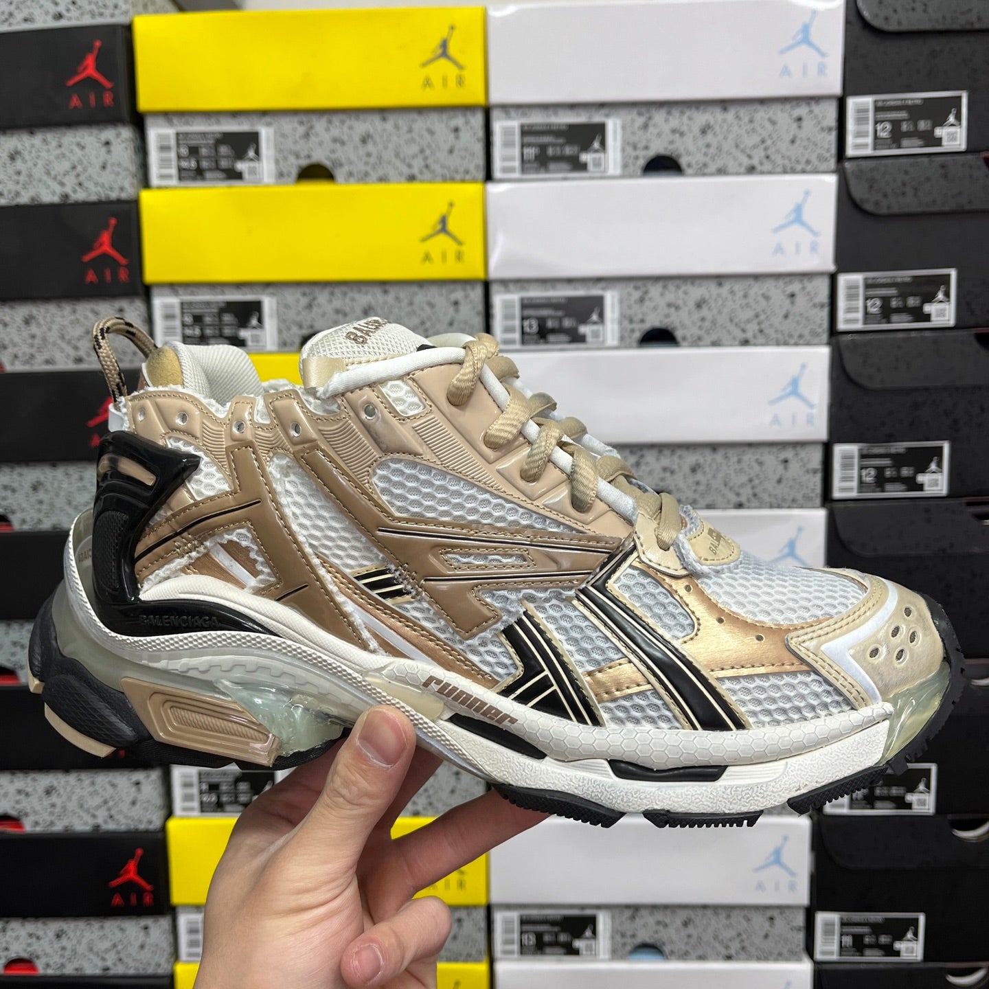 Balenciaga unisex sneakers in light gold and white with black heel accents