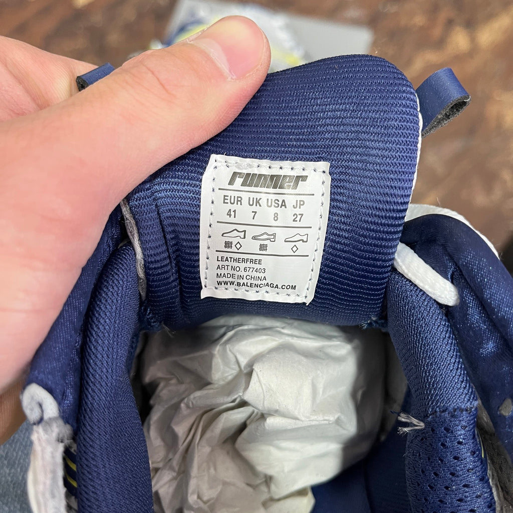 Unisex runner shoes size label on blue fabric tongue, white label with size info