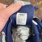 Unisex runner shoes size label on blue fabric tongue, white label with size info