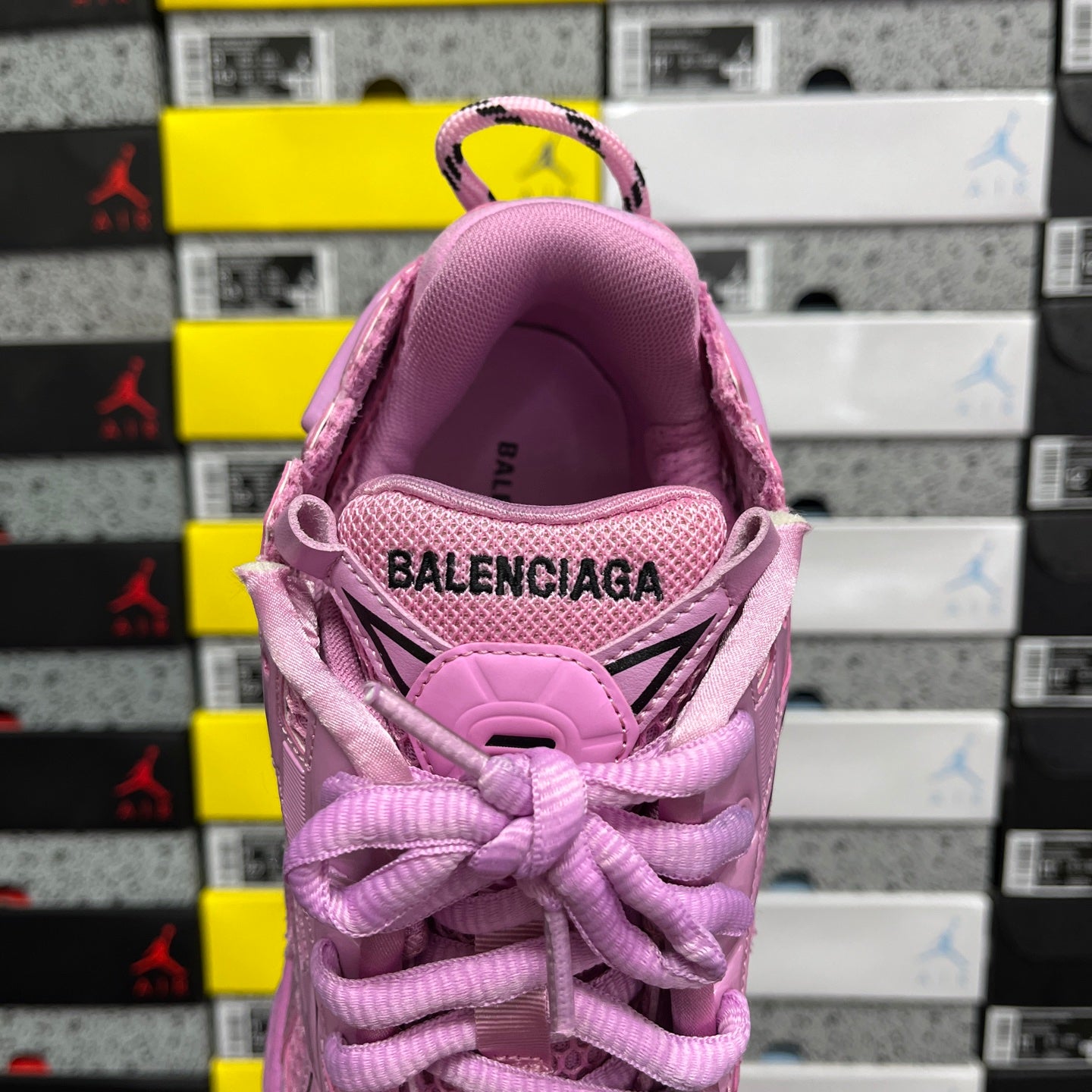 Pink sneaker heel view with BALENCIAGA on the inner collar lining.