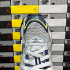 Unisex runner shoe heel, silver mesh with blue collar and white laces; logo detail