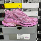 Pink mesh lace-up sneaker, side panel detailing and thick cushioned sole.