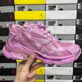 Pink mesh lace-up sneaker with cushioned sole and padded collar.
