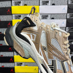 Balenciaga unisex sneakers in light gold and white with black strap and chunky sole