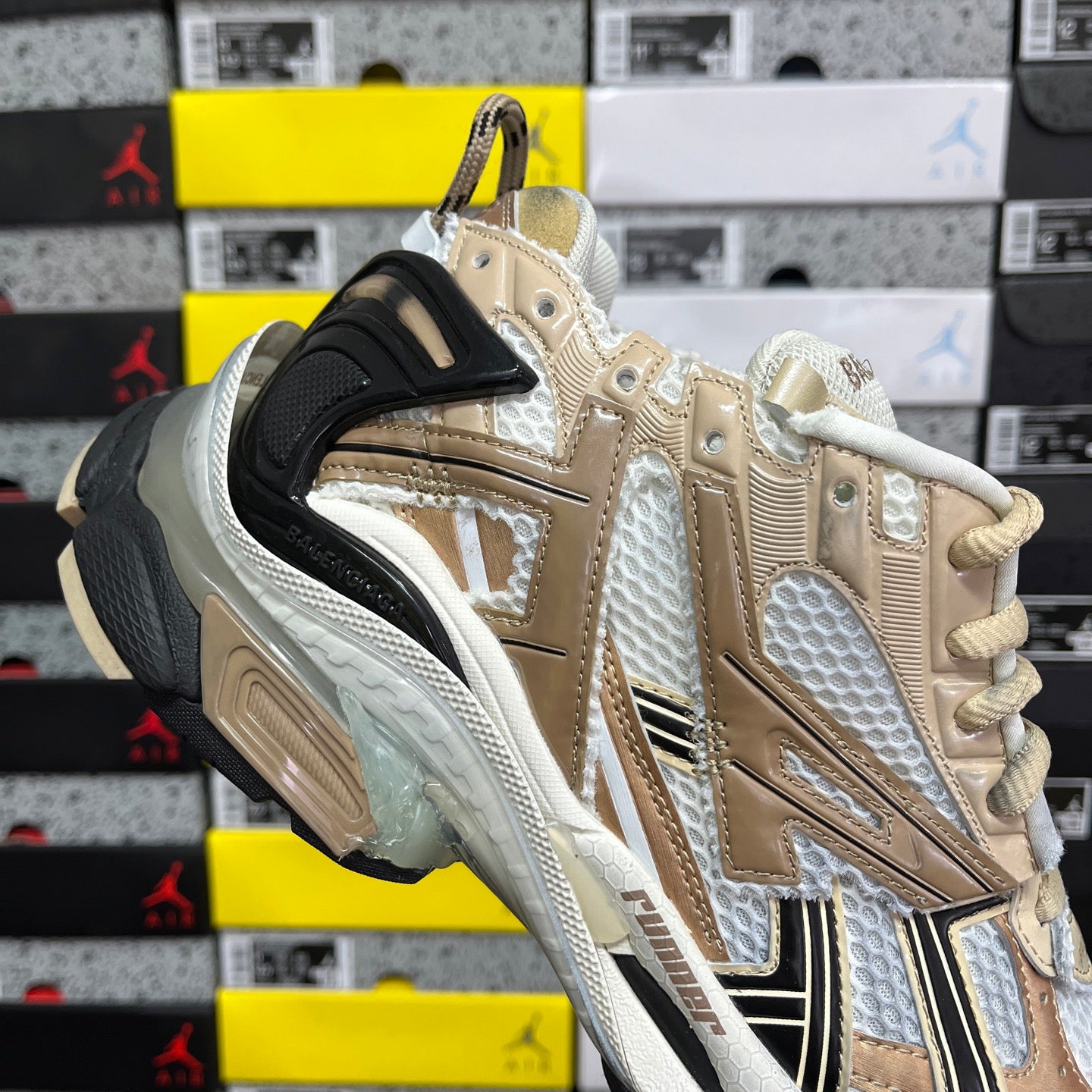 Balenciaga unisex sneakers in light gold and white with black strap and chunky sole
