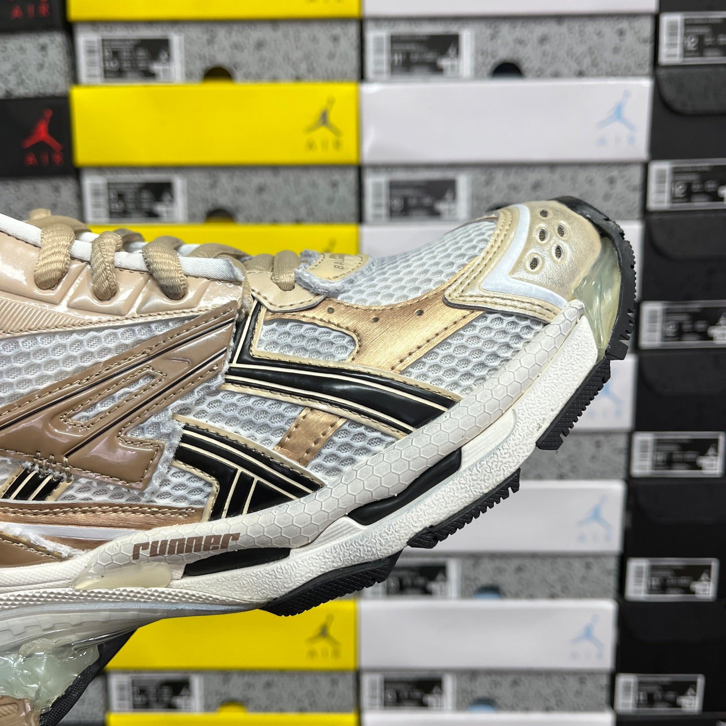 Balenciaga unisex sneakers in light gold and white with metallic logo stripe