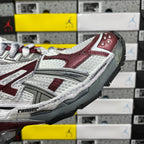 Balenciaga sneakers side detail, silver texture with burgundy overlays, treaded sole