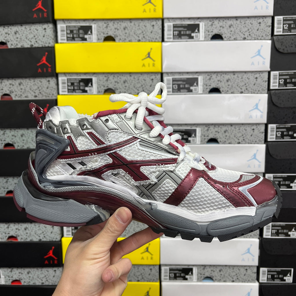 Balenciaga unisex sneakers front-left view, silver upper with burgundy stripes and white laces