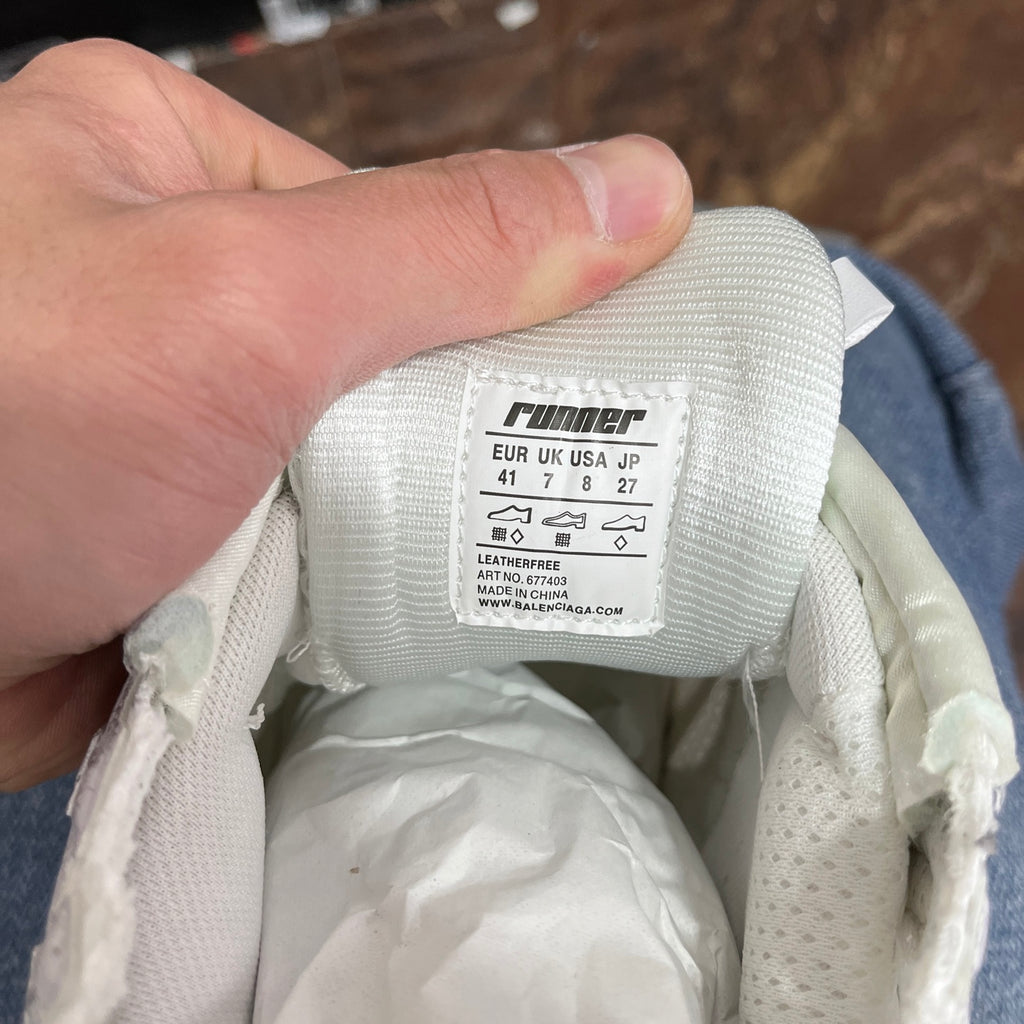 Balenciaga sneaker size label inside with text and numbers on white fabric
