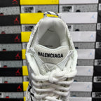 White Balenciaga sneakers with cushioned collar and embroidered BALENCIAGA on heel