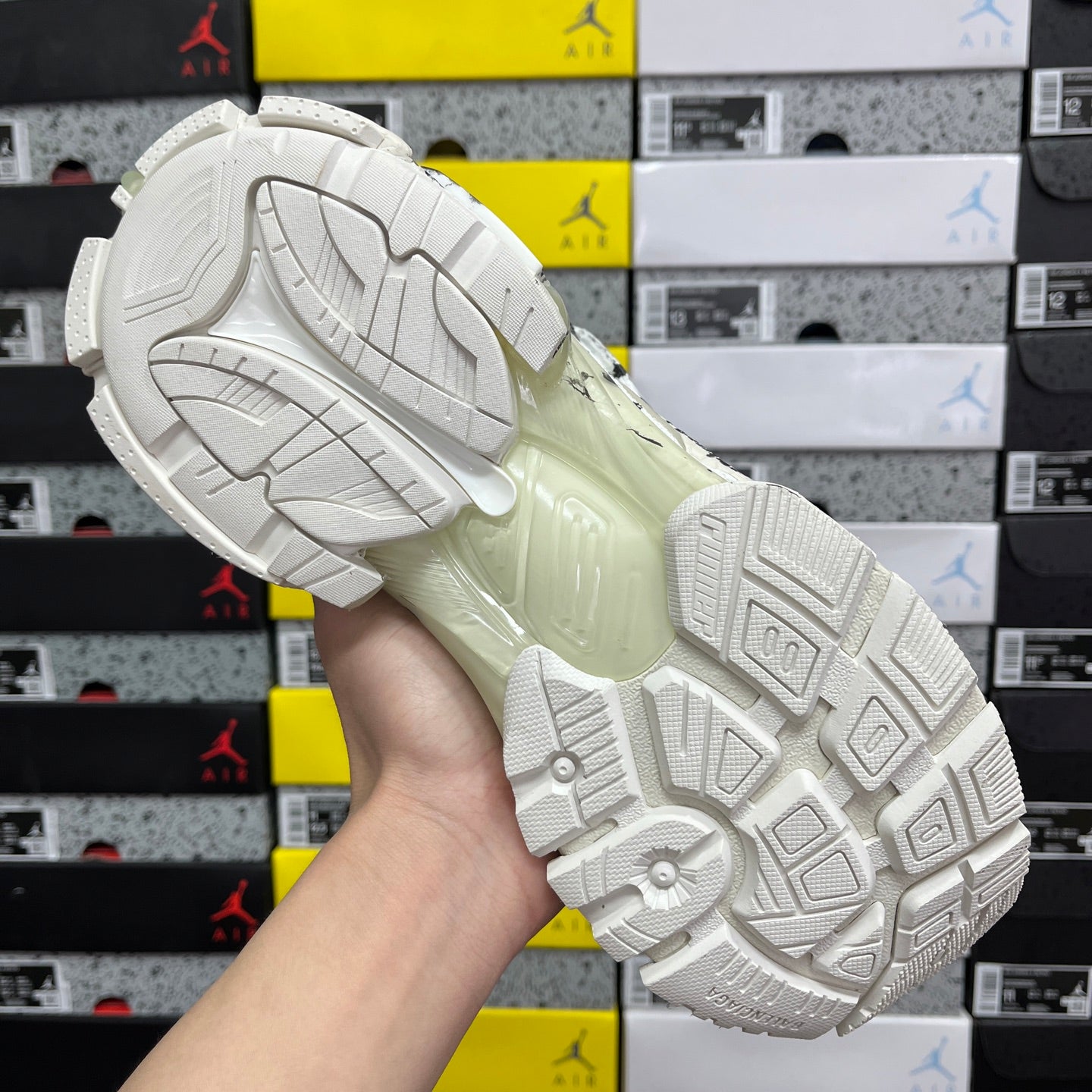 White Balenciaga sneakers outsole with tread pattern and off-white midfoot