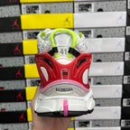 Unisex sneaker heel view with red heel guard, pink accent stripe, BALENCIAGA logo