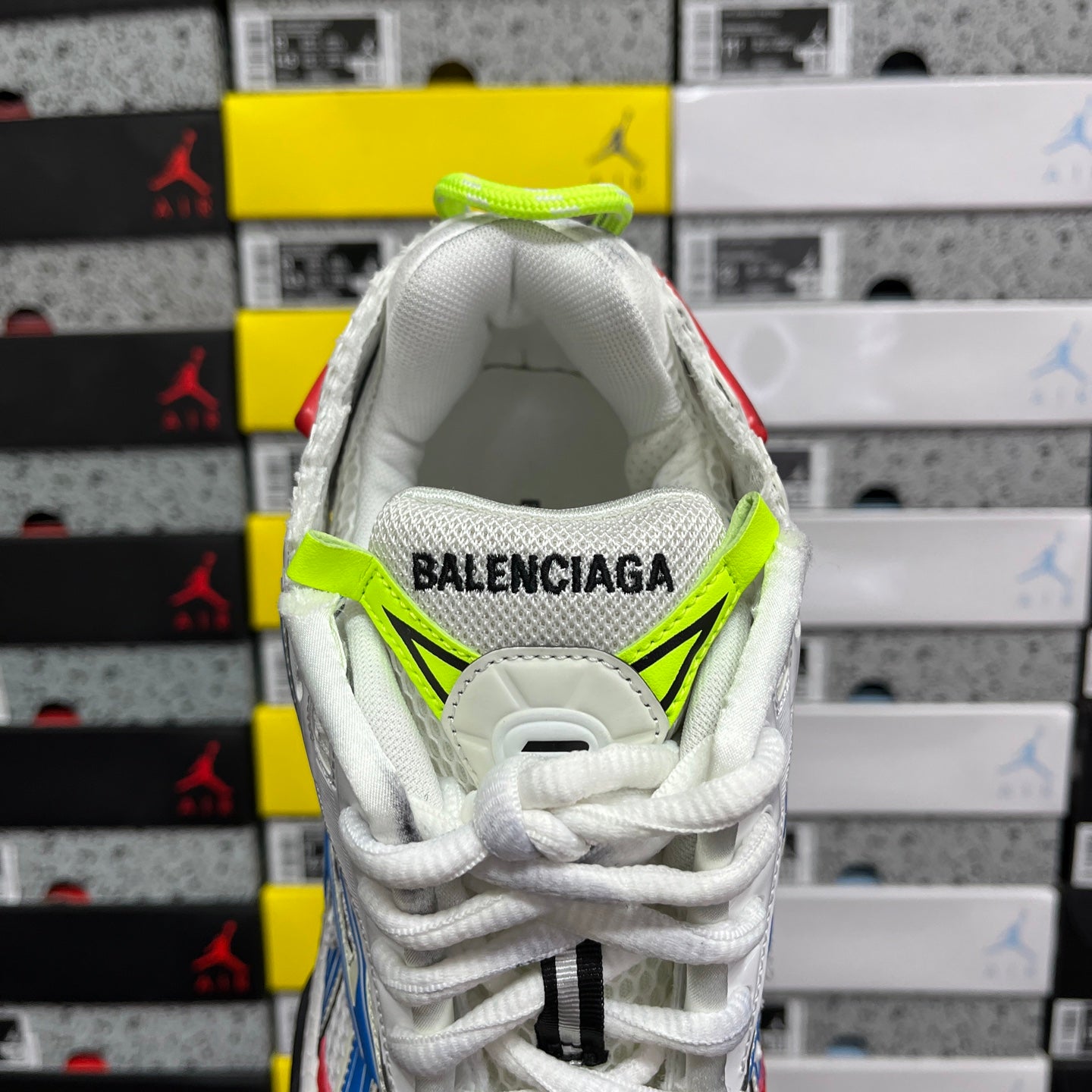 Unisex sneaker interior with green collar trim and BALENCIAGA logo on the tongue