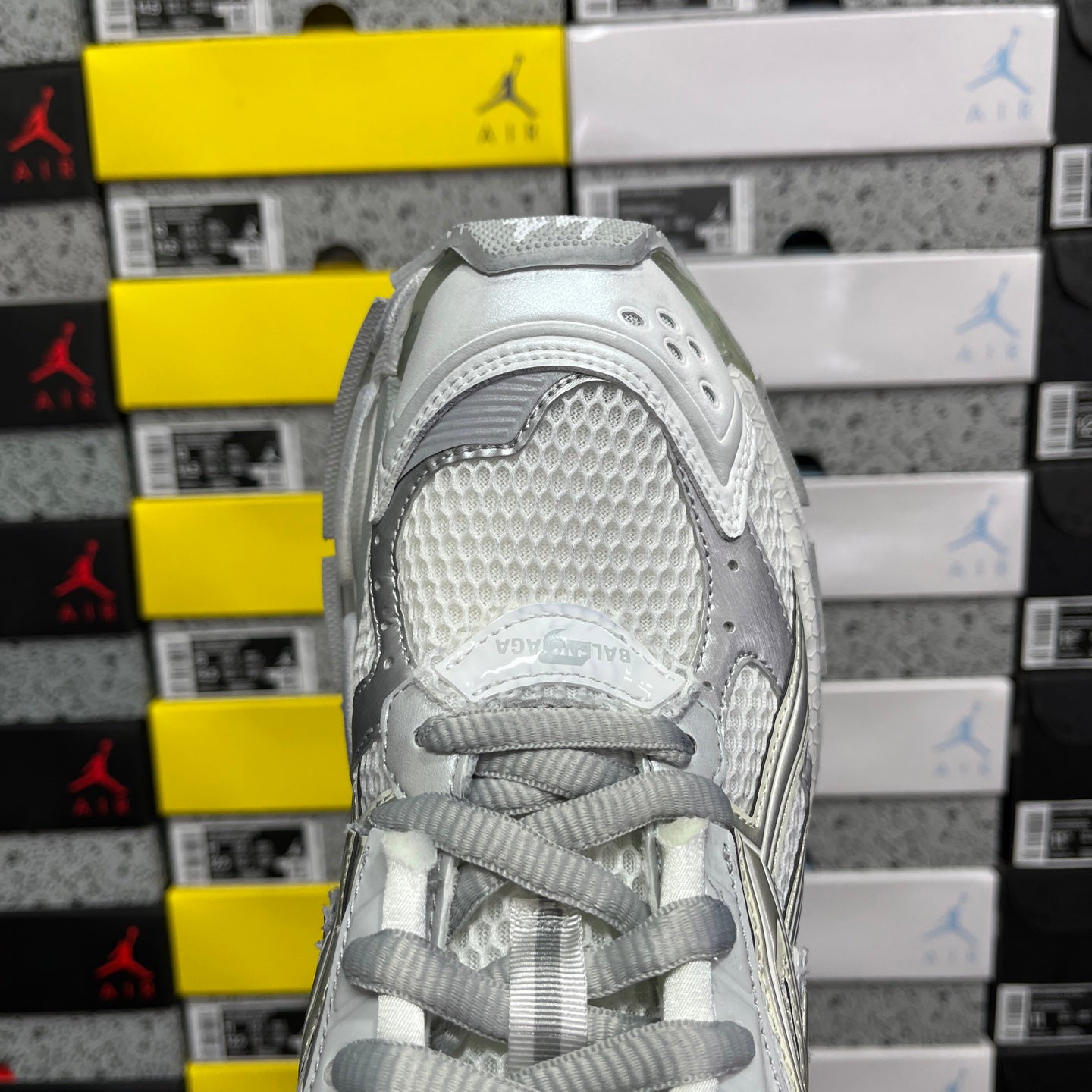 Light silver/white lace-up sneaker, textured toe and padded heel collar