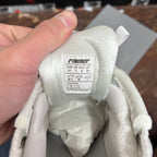 Light silver/white shoe tongue label with size and materials information