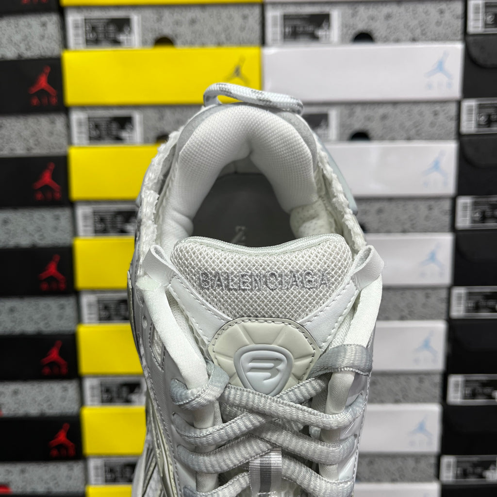 Light silver/white lace-up sneaker with padded collar and stitched heel strap