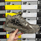 Balenciaga unisex sneakers front-side view in taupe with black stripe and laces