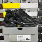 Black Balenciaga running sneaker, side view with padded collar and chunky sole