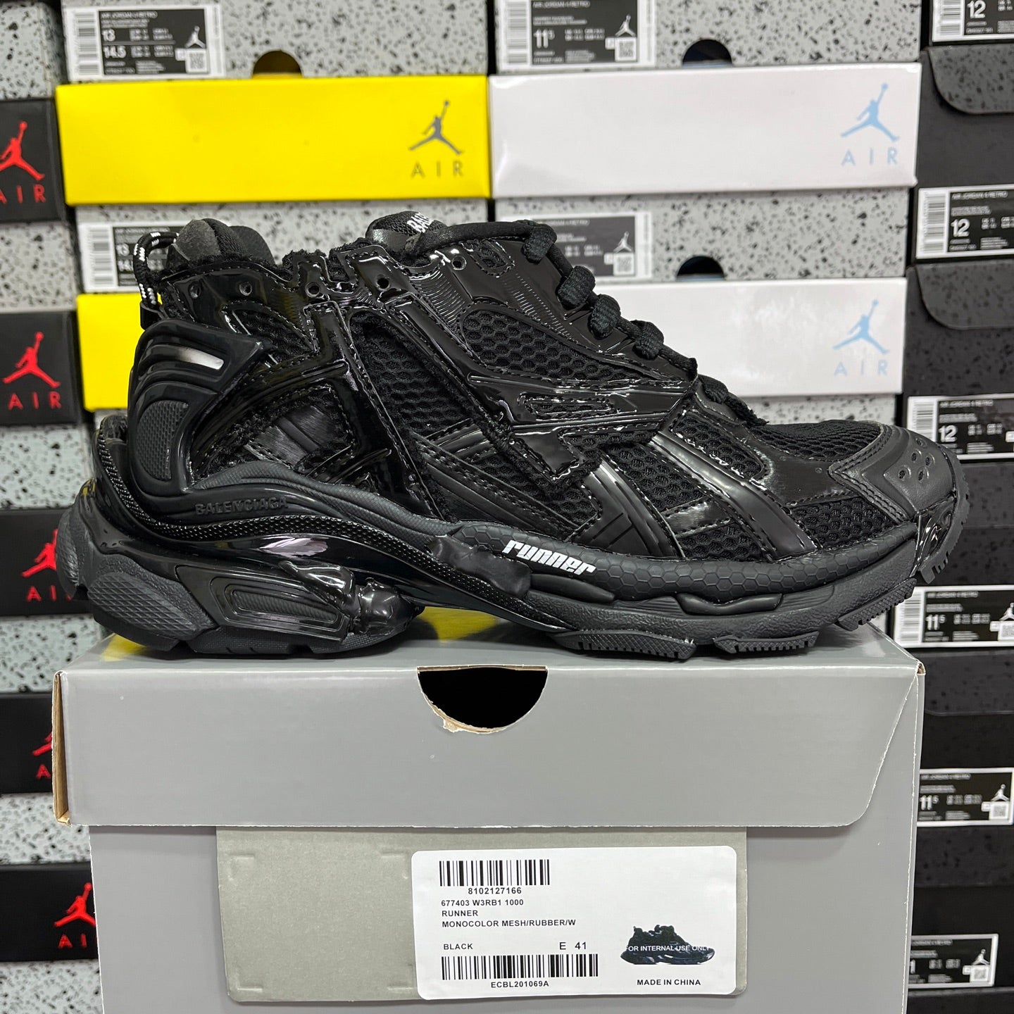 Black Balenciaga running sneaker, side view with padded collar and chunky sole