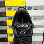 Black Balenciaga running sneaker tongue and heel area with BALENCIAGA branding