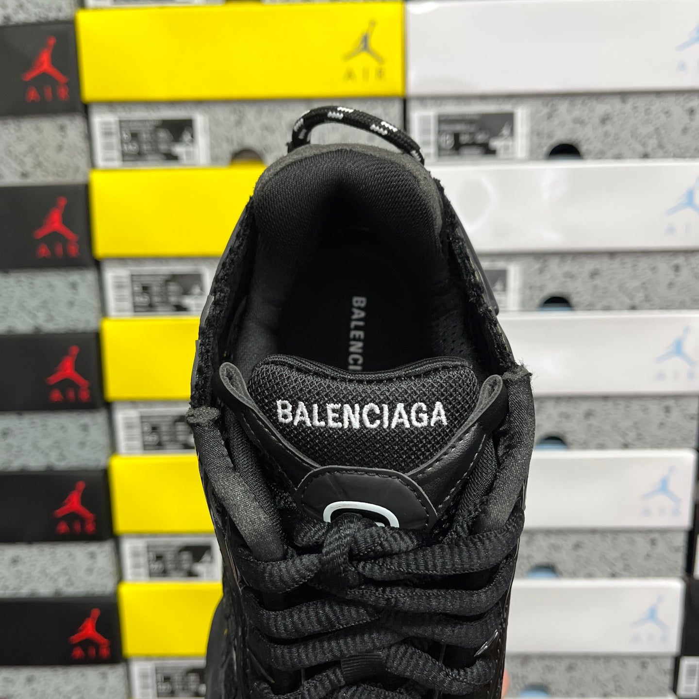Black Balenciaga running sneaker tongue and heel area with BALENCIAGA branding