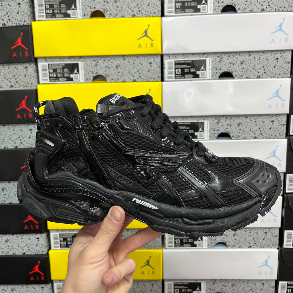 Black Balenciaga running sneaker with textured upper and black laces