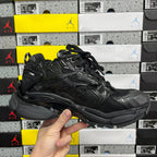 Black Balenciaga running sneaker, three-quarter side view with chunky midsole