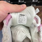 Shoe interior label with size info and RNumer logo on white tongue lining