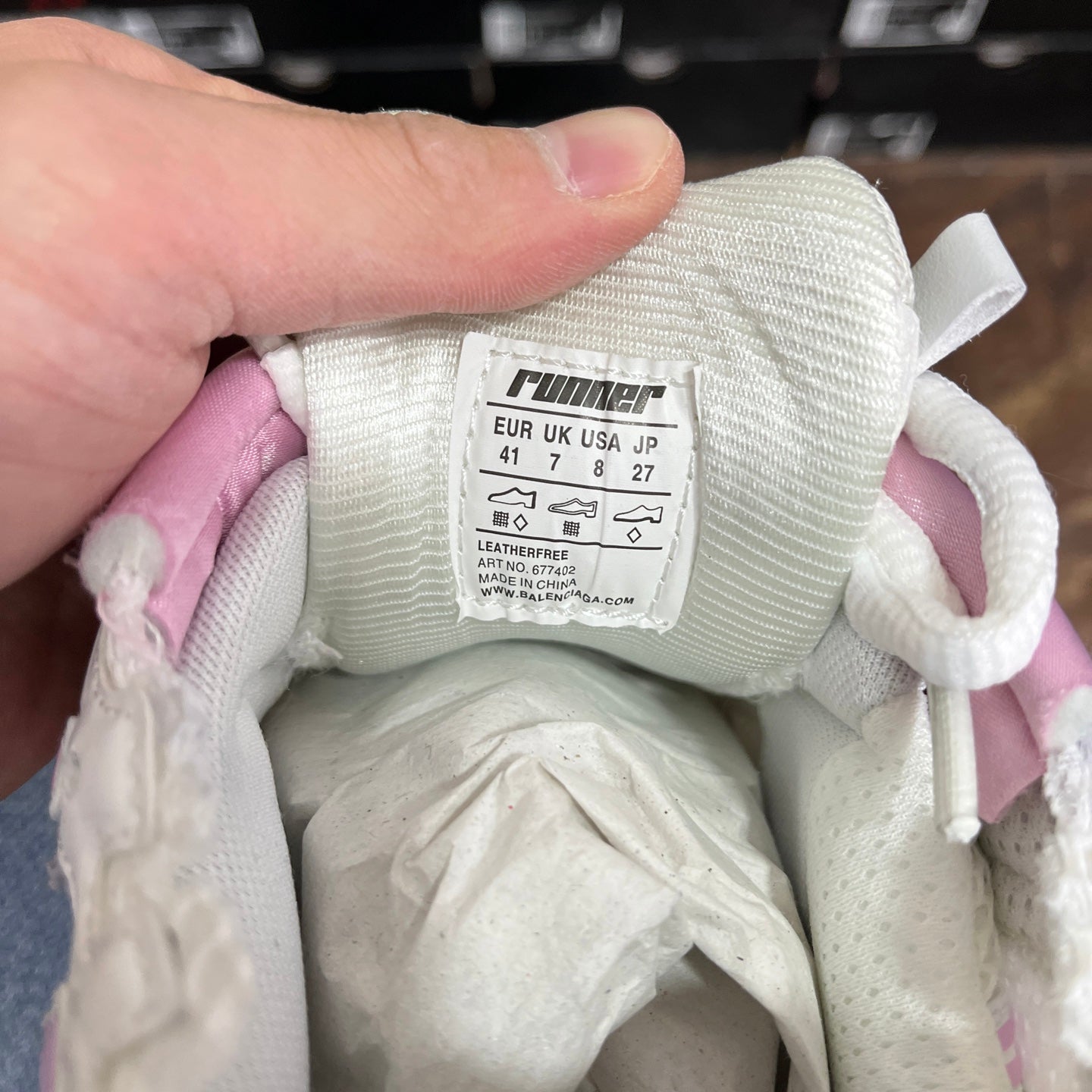 Shoe interior label with size info and RNumer logo on white tongue lining