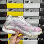 White and pink lace-up running sneaker with textured side panels and chunky sole