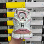 White and pink sneaker heel with size 41 marking and padded collar detail