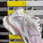 White and pink lace-up sneaker with contrast pink heel and side panel details