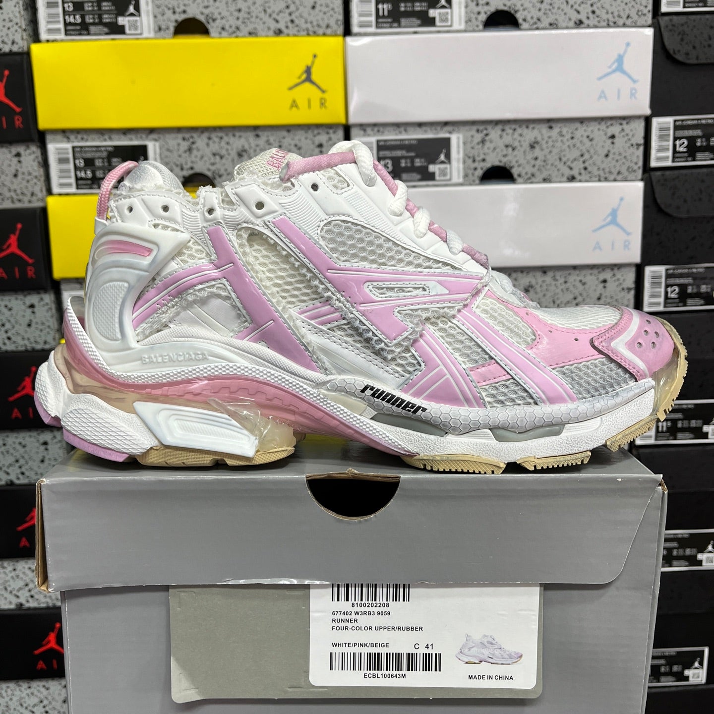 White and pink lace-up running sneaker with chunky midsole and rubber outsole