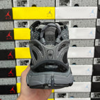 Grey lace-up runner sneaker heel with size tag marked 39.
