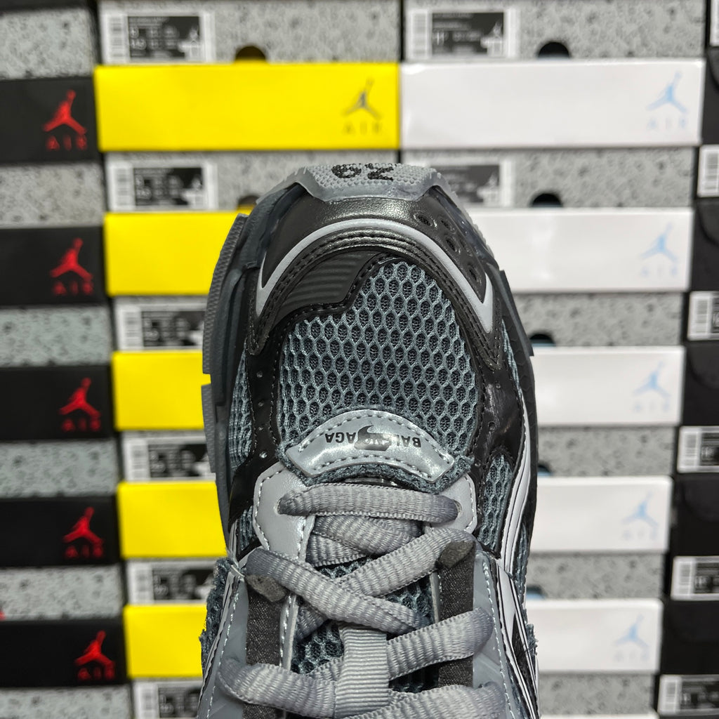 Balenciaga grey mesh lace-up sneaker close-up with tongue and padded collar.
