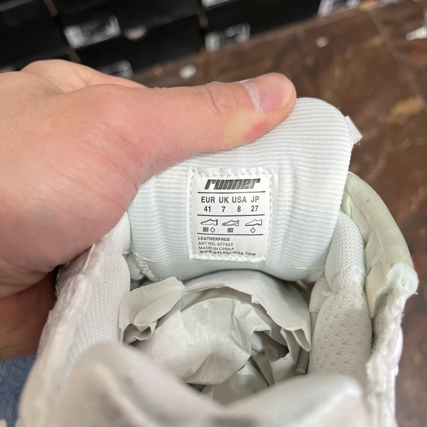 White Balenciaga unisex sneakers, inside tag and fabric lining near the tongue