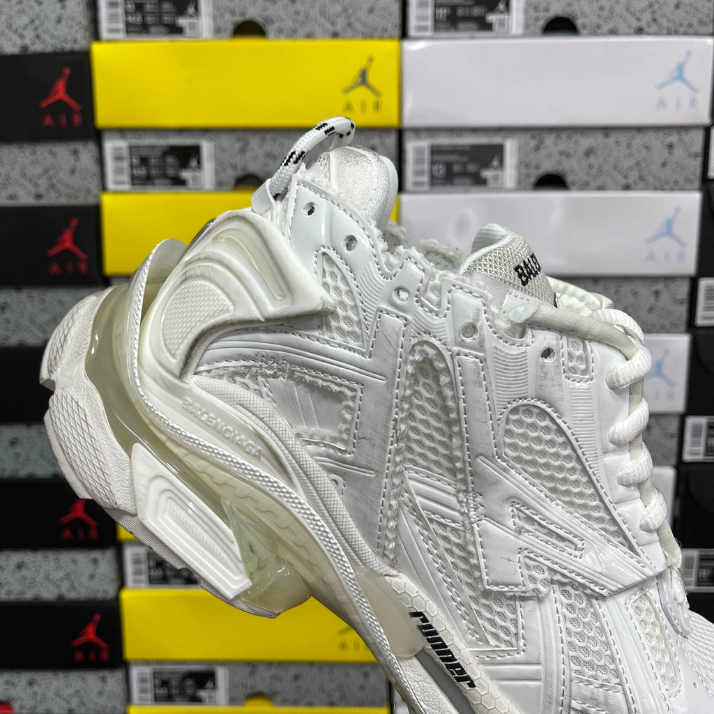 White Balenciaga unisex sneakers, heel and side view with padded collar