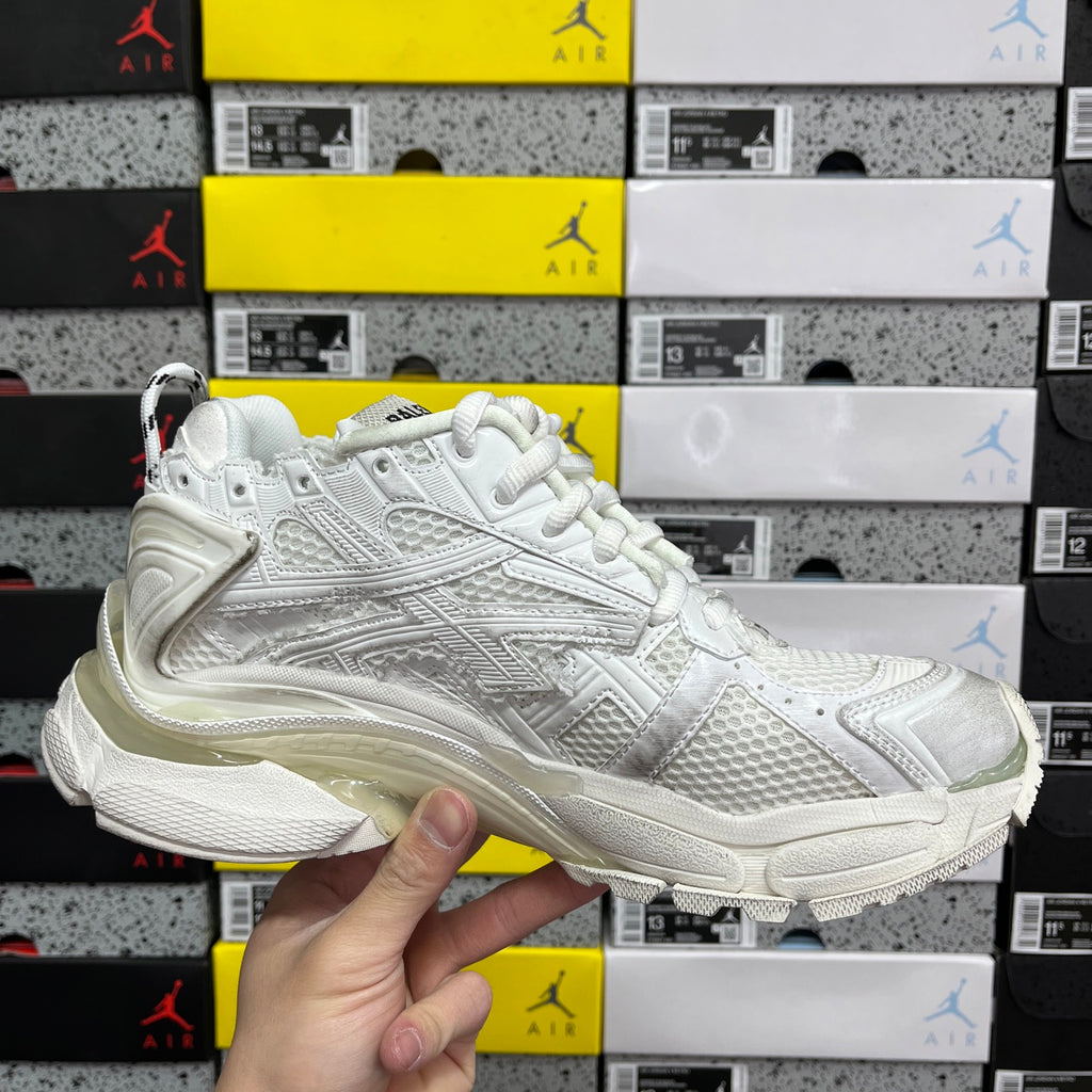 White Balenciaga unisex sneakers, front side view with lace-up upper and chunky midsole