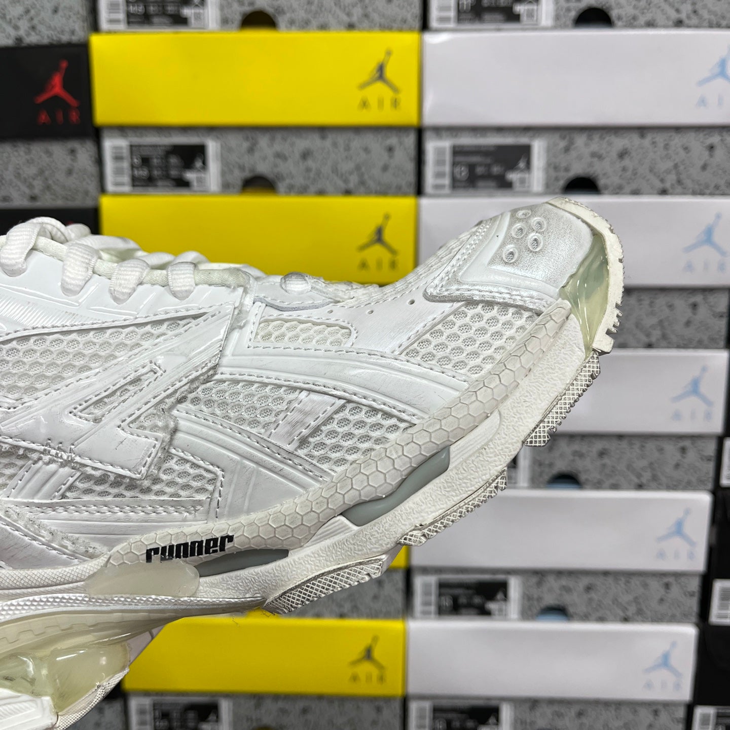 White Balenciaga unisex sneakers, side detail with sculpted sole and embossed panels