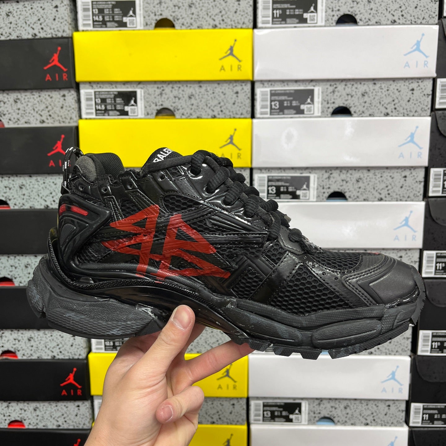 Black and red Balenciaga runner sneaker, opposite side view
