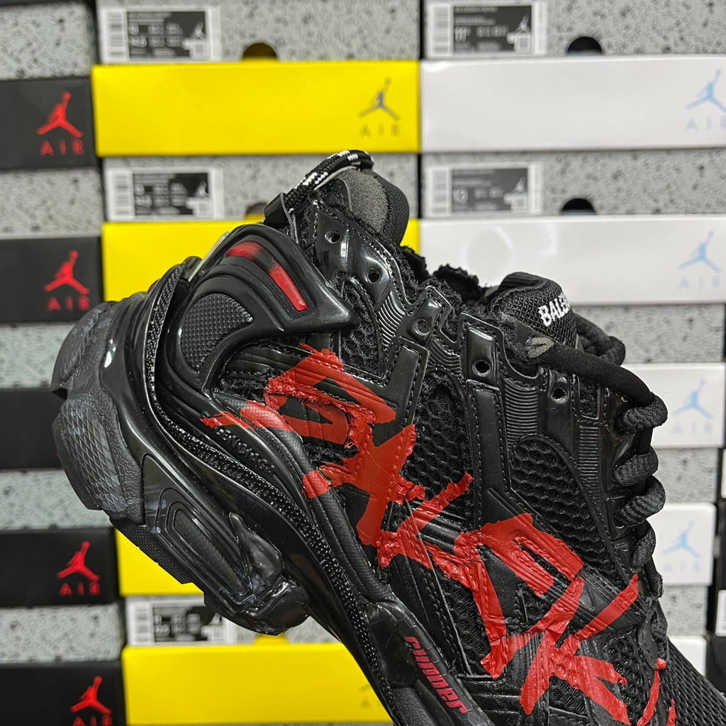 Black and red Balenciaga runner sneaker, lateral view with chunky sole