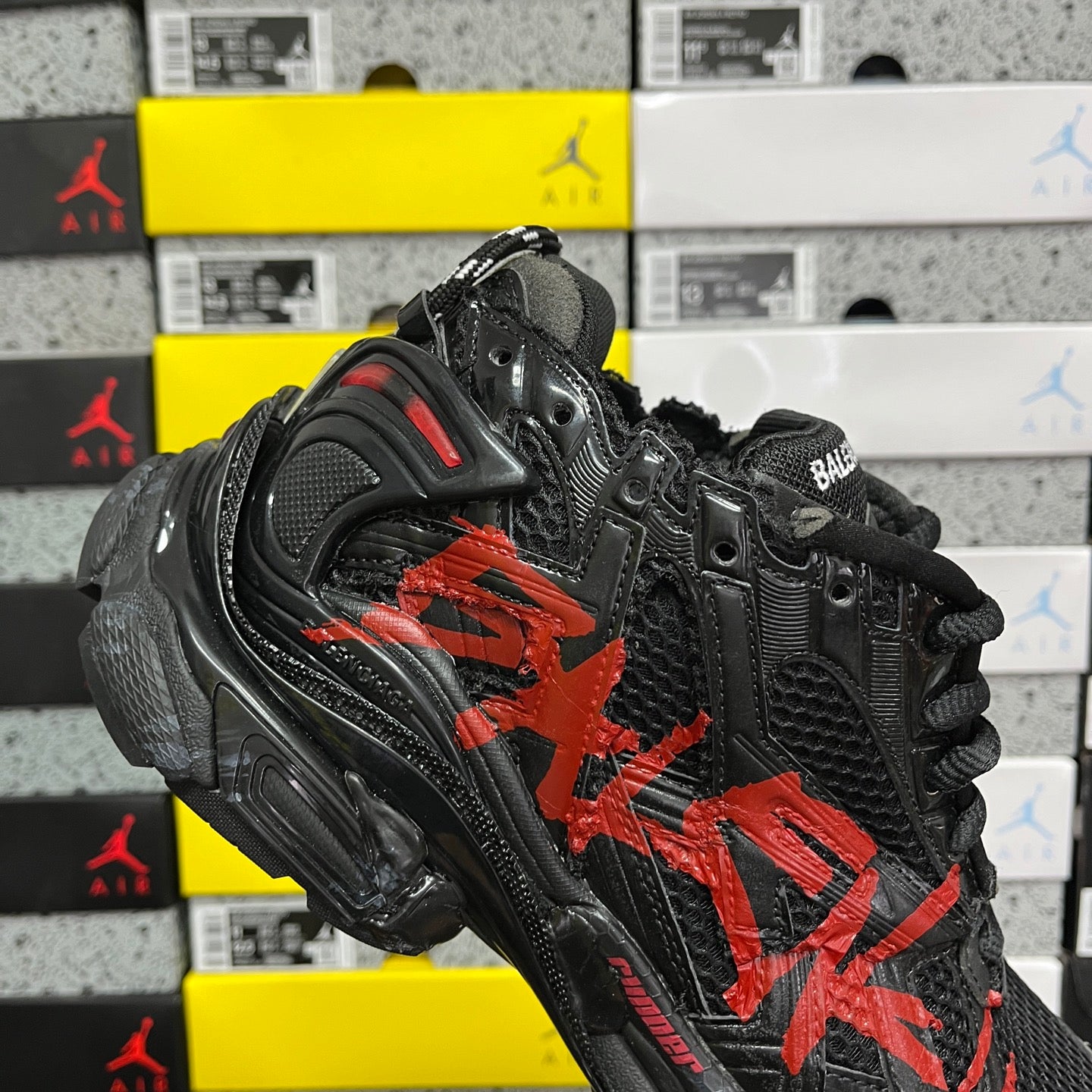 Black and red Balenciaga runner sneaker, lateral view with chunky sole