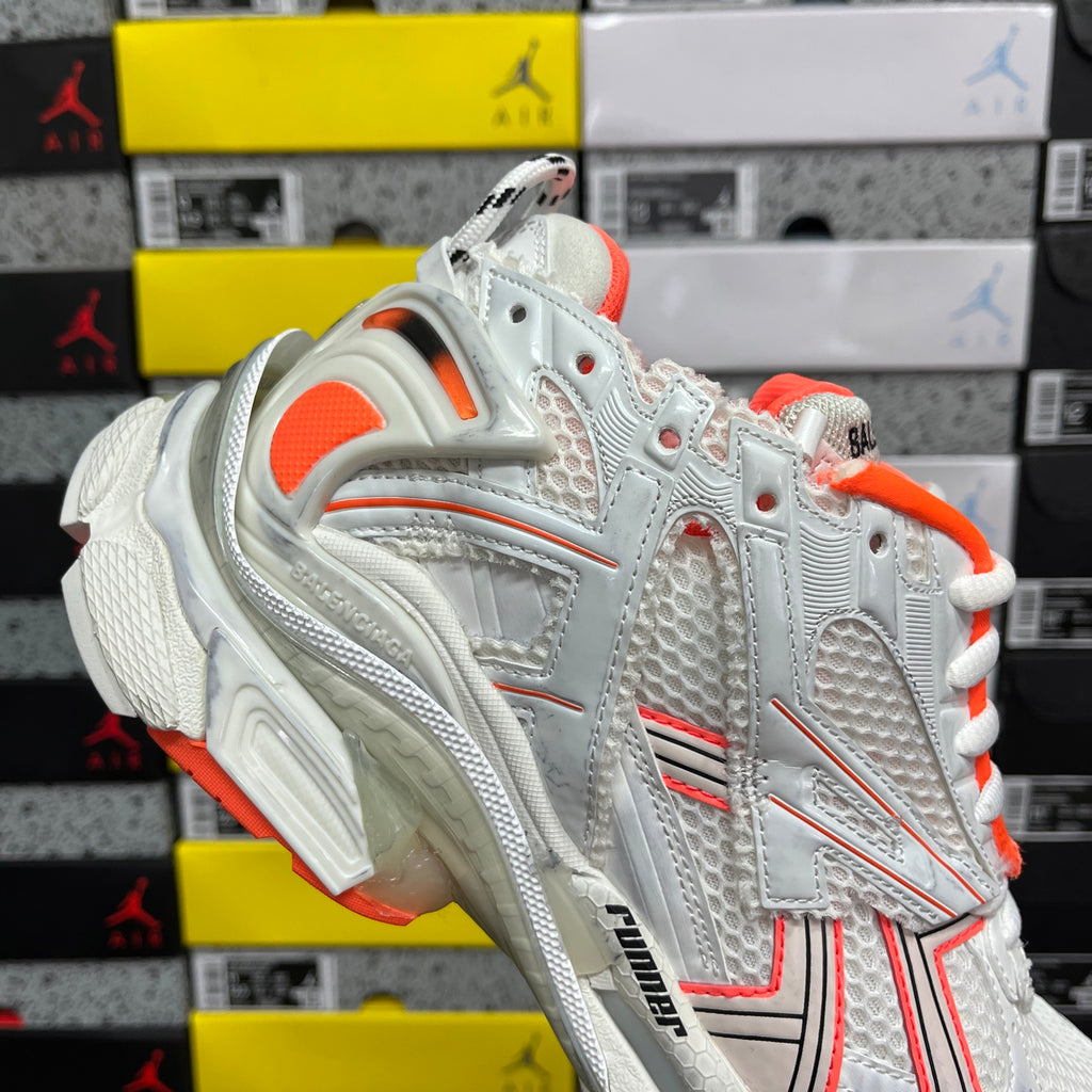 Balenciaga runner sneakers quarter close-up, white mesh with orange lining and laces
