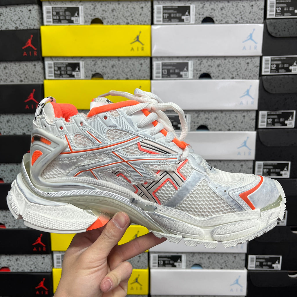 Balenciaga runner sneakers 3/4 view, white mesh with orange stripes and thick sole