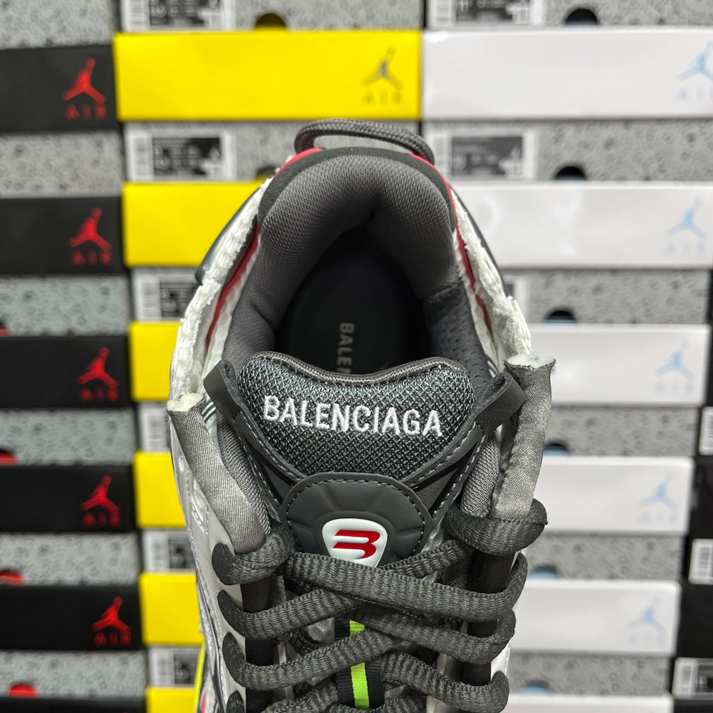 Gray and white sneaker interior heel lining with BALENCIAGA logo patch
