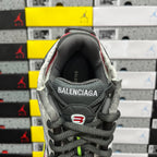Gray and white sneaker interior heel lining with BALENCIAGA logo patch