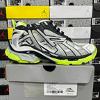 Balenciaga unisex sneakers on box, silver mesh upper, black accents, neon green sole