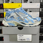 Blue and white lace-up athletic sneaker, side view with thick cushioned sole